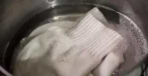 boil the socks to shrink socks