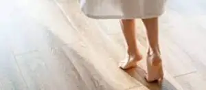 foot without bootie slippers on floor